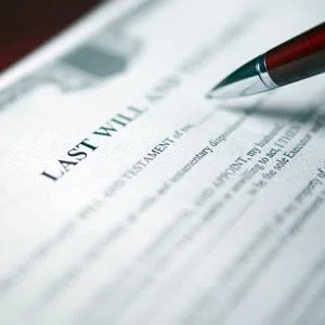 A pen hovering over a will